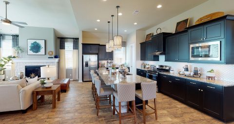 5-HOU-chesmarhomes-HILLCREST-modelhome-Meridiana-kitchenliving-480x254.jpg
