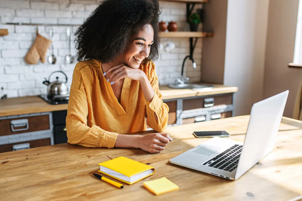 Woman searching for homes on laptop