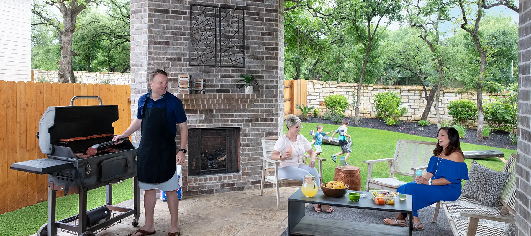Man grilling on back patio